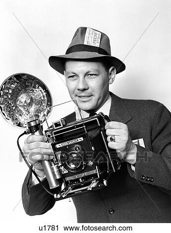 1930S 1940S 1950S Press Photographer Man Holding Speed Graphic Camera With Flash Bulb Illumination View Large Photo Image Stock Image - 1930S 1940S 1950S Press Photographer Man Holding Speed Graphic Camera With Flash Bulb Illumination. Fotosearch