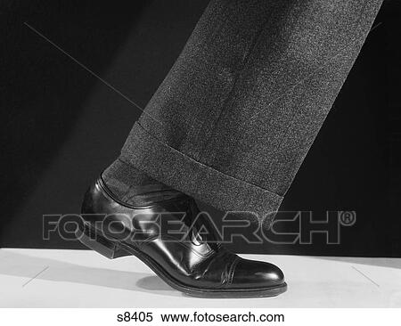 1930S 1940S 1950S Walking Man’S Single Leg Leather Shoe And Pant Cuff View Large Photo Image Stock Photography - 1930S 1940S 1950S Walking Man’S Single Leg Leather Shoe And Pant Cuff. Fotosearch