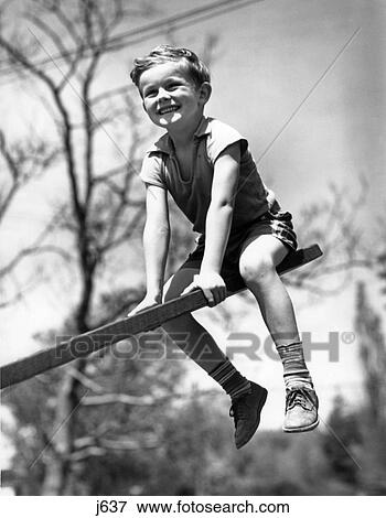 1930S 1940S Boy On Seesaw Smiling View Large Photo Image Stock Photo - 1930S 1940S Boy On Seesaw Smiling. Fotosearch