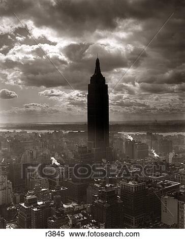 1930S 1940S Empire State Building New York City In Storm Cloud Cover View Large Photo Image Stock Photography - 1930S 1940S Empire State Building New York City In Storm Cloud Cover. Fotosearch