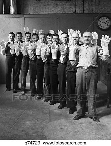 1930S 1940S Men Wearing Large Asbestos Gloves Made In New Jersey Usa Factory For Ww2 London Fire Fighters View Large Photo Image Stock Photo - 1930S 1940S Men Wearing Large Asbestos Gloves Made In New Jersey Usa Factory For Ww2 London Fire Fighters. Fotosearch