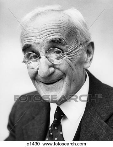 Stock Image - 1930S 1940S Older Man Smiling Wearing Eyeglasses. Fotosearch