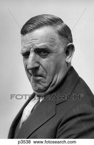 1930S 1940S Portrait Of Gruff Older Man Businessman Salesman Character Winking View Large Photo Image Stock Photo - 1930S 1940S Portrait Of Gruff Older Man Businessman Salesman Character Winking. Fotosearch