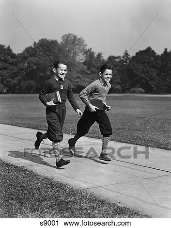 1930S 1940S Two Smiling Boys Running Carrying School Books View Large Photo Image Stock Image - 1930S 1940S Two Smiling Boys Running Carrying School Books. Fotosearch