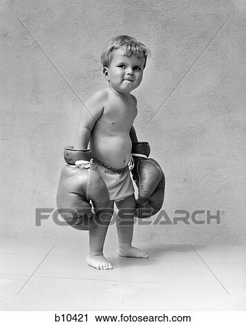 1930S Baby Boy Toddler Wearing Oversize Boxing Gloves View Large Photo Image Stock Image - 1930S Baby Boy Toddler Wearing Oversize Boxing Gloves. Fotosearch