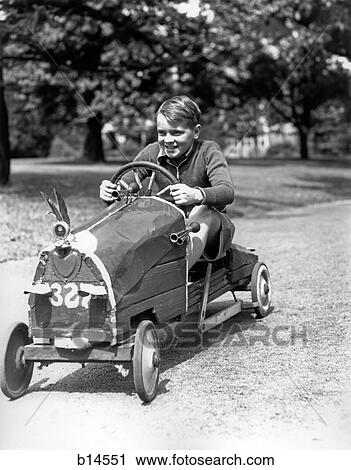 1930S Boy Driving Home Built Race Car Holding Steering Wheel View Large Photo Image Stock Image - 1930S Boy Driving Home Built Race Car Holding Steering Wheel. Fotosearch