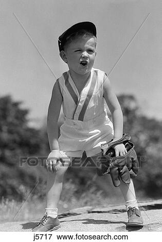1930S Boy Wearing Baseball Hat & Glove Bent Over With Hands On Knees Yelling View Large Photo Image Stock Photo - 1930S Boy Wearing Baseball Hat & Glove Bent Over With Hands On Knees Yelling. Fotosearch