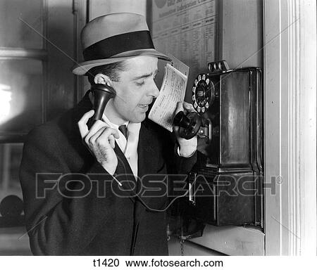 1930S Businessman In Hat And Suit Talking On Public Pay Telephone Sales Man Calling In Order View Large Photo Image Stock Image - 1930S Businessman In Hat And Suit Talking On Public Pay Telephone Sales Man Calling In Order. Fotosearch
