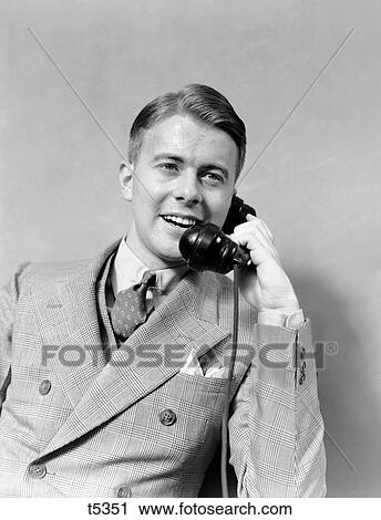 1930S Businessman In Plaid Suit And Vest Talking On Telephone Smiling Double Breasted View Large Photo Image Stock Image - 1930S Businessman In Plaid Suit And Vest Talking On Telephone Smiling Double Breasted . Fotosearch
