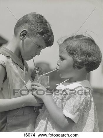 1930S Children Boy Girl Sharing Drinking Glass Using Straws View Large Photo Image Picture - 1930S Children Boy Girl Sharing Drinking Glass Using Straws. Fotosearch