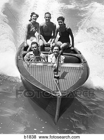 Stock Photo - 1930S Couples Five Men And Women Riding In Runabout Power Boat. Fotosearch