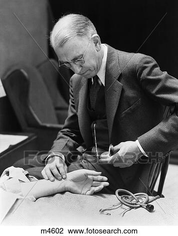 1930S Doctor At Bedside Taking Patient'S Pulse Timing With Pocket Watch View Large Photo Image Stock Image - 1930S Doctor At Bedside Taking Patient'S Pulse Timing With Pocket Watch. Fotosearch