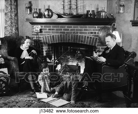 1930S Family Of Four Sitting In Front Fireplace Mother Knitting Father Reading Smoking Pipe Kids Doing Homework View Large Photo Image Stock Image - 1930S Family Of Four Sitting In Front Fireplace Mother Knitting Father Reading Smoking Pipe Kids Doing Homework. Fotosearch