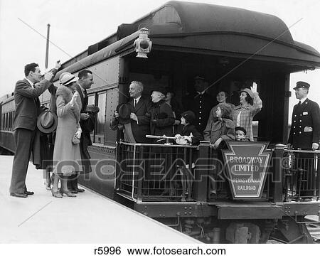 1930S Family With Grandparents & Conductor On Broadway Limited Observation Car Train Platform Waving Goodbye & Farewell View Large Photo Image Stock Photograph - 1930S Family With Grandparents & Conductor On Broadway Limited Observation Car Train Platform Waving Goodbye & Farewell. Fotosearch