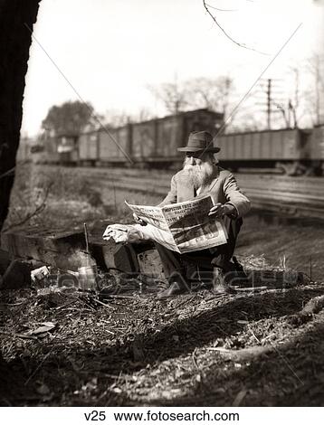 1930S Hobo Sitting By Railroad Track Reading Newspaper During Great Depression View Large Photo Image Stock Photography - 1930S Hobo Sitting By Railroad Track Reading Newspaper During Great Depression. Fotosearch