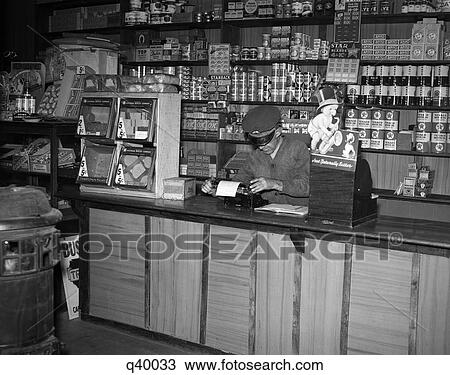 1930S Man Behind Counter In General Store Using Typewriter View Large Photo Image Stock Image - 1930S Man Behind Counter In General Store Using Typewriter. Fotosearch