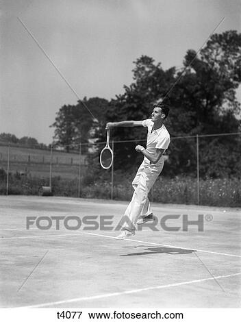 1930S Man Playing Tennis Jumping Mid Air Action View Large Photo Image Stock Photo - 1930S Man Playing Tennis Jumping Mid Air Action. Fotosearch