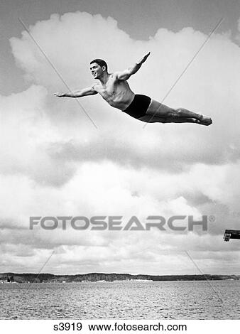 1930S Man Swan Diving From High Diving Board Outdoor View Large Photo Image Stock Photo - 1930S Man Swan Diving From High Diving Board Outdoor. Fotosearch