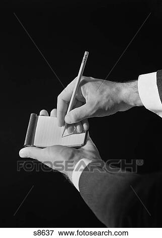 Stock Photo - 1930S Man’S Hands Writing On Note Pad With Pencil. Fotosearch