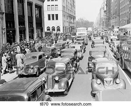 1930S Pedestrian Crowds And Traffic On 5Th Avenue Nyc Cars Taxis Buses Street Congestion At 67Th Street View Large Photo Image Stock Image - 1930S Pedestrian Crowds And Traffic On 5Th Avenue Nyc Cars Taxis Buses Street Congestion At 67Th Street. Fotosearch