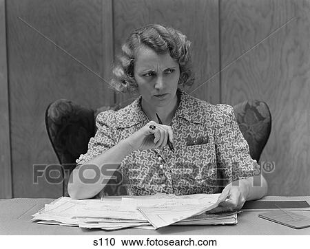 1930S Serious Worried Woman At Desk Going Over Papers Bills Looking Off To Side View Large Photo Image Stock Image - 1930S Serious Worried Woman At Desk Going Over Papers Bills Looking Off To Side. Fotosearch