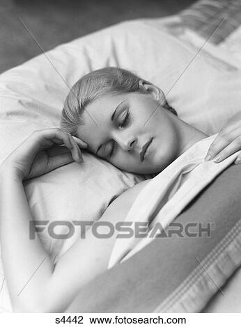 1930S Sleeping Blond Woman Eyes Closed Head Resting On Pillow In Bed View Large Photo Image Stock Image - 1930S Sleeping Blond Woman Eyes Closed Head Resting On Pillow In Bed. Fotosearch