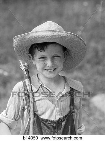 1930S Smiling Boy In Overalls & Straw Hat With Fishing Pole Slung Over Shoulder View Large Photo Image Stock Image - 1930S Smiling Boy In Overalls & Straw Hat With Fishing Pole Slung Over Shoulder. Fotosearch