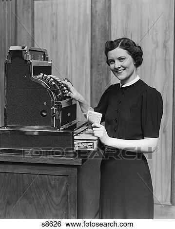 1930S Smiling Sales Woman Ringing Up Sale On Cash Register View Large Photo Image Stock Photograph - 1930S Smiling Sales Woman Ringing Up Sale On Cash Register . Fotosearch