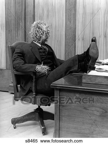 1930s Straw Man In Suit Tie Seated In Executive Chair With Feet