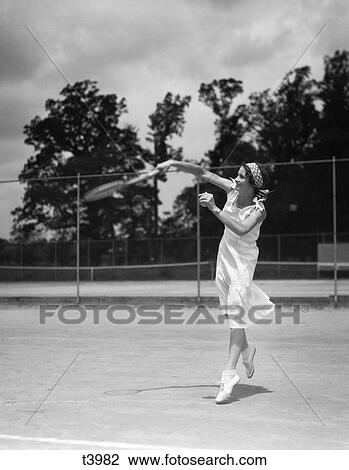 1930S Woman Playing Tennis Action View Large Photo Image Stock Image - 1930S Woman Playing Tennis Action. Fotosearch