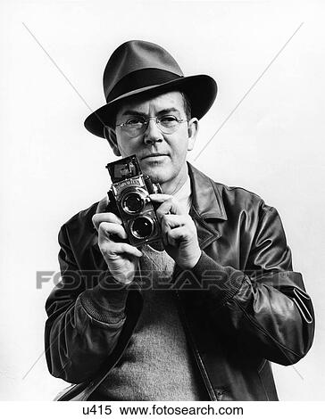 1940S 1930S H. Armstrong Roberts Holding A Twin Lens Medium Format Camera View Large Photo Image Stock Photography - 1940S 1930S H. Armstrong Roberts Holding A Twin Lens Medium Format Camera. Fotosearch