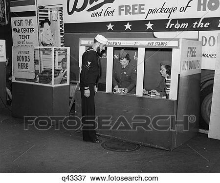 1940S 1943 Sailor Buying War Stamps At Donut Mobile At Bowling Green New York City View Large Photo Image Stock Photo - 1940S 1943 Sailor Buying War Stamps At Donut Mobile At Bowling Green New York City. Fotosearch