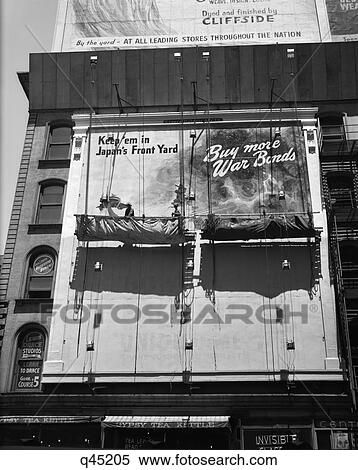 Stock Photography - 1940S 1945 New York City Sign Painters Corner 42Nd Street Fifth Avenue Painting New War Bonds Sign From Scaffold. Fotosearch