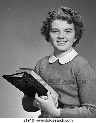 1940S 1950S Adolescent Teen Girl Smiling Portrait Holding School Books View Large Photo Image Stock Image - 1940S 1950S Adolescent Teen Girl Smiling Portrait Holding School Books. Fotosearch