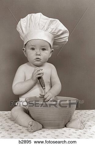 1940S 1950S Baby Cook With Chef Hat Spoon Mixing Bowl Staring Straight Ahead Studio View Large Photo Image Stock Photography - 1940S 1950S Baby Cook With Chef Hat Spoon Mixing Bowl Staring Straight Ahead Studio. Fotosearch
