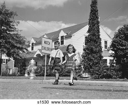 1940S 1950S Boy Girl Holding Hands Crossing Street Going To School Watch Children Sign View Large Photo Image Stock Image - 1940S 1950S Boy Girl Holding Hands Crossing Street Going To School Watch Children Sign. Fotosearch