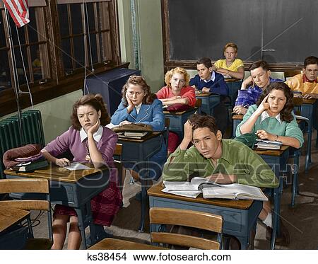 1940S 1950S High School Classroom Of Bored Students Sitting At Desks View Large Photo Image Picture - 1940S 1950S High School Classroom Of Bored Students Sitting At Desks. Fotosearch