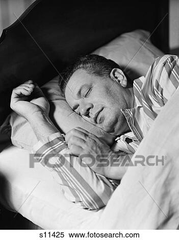 1940S 1950S Man Asleep Sleeping In Bed Wearing Pajamas View Large Photo Image Stock Photography - 1940S 1950S Man Asleep Sleeping In Bed Wearing Pajamas. Fotosearch