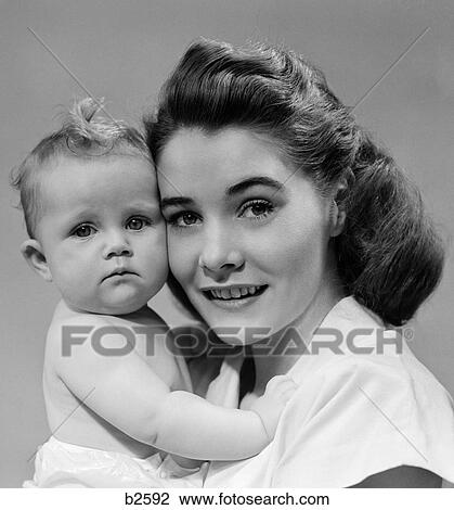 1940S 1950S Portrait Of Mother Hugging Baby View Large Photo Image Stock Image - 1940S 1950S Portrait Of Mother Hugging Baby. Fotosearch