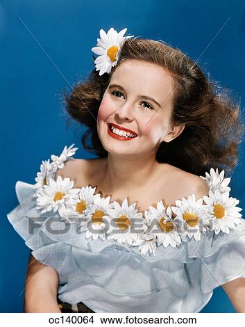 1940S 1950S Portrait Smiling Teen Girl Wearing Off The Shoulder Blouse With Daisies Around Collar Daisy In Hair View Large Photo Image Picture - 1940S 1950S Portrait Smiling Teen Girl Wearing Off The Shoulder Blouse With Daisies Around Collar Daisy In Hair. Fotosearch