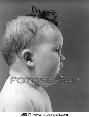Stock Photo - 1940S 1950S Profile Of Baby Head With Mouth Open Indoor. Fotosearch