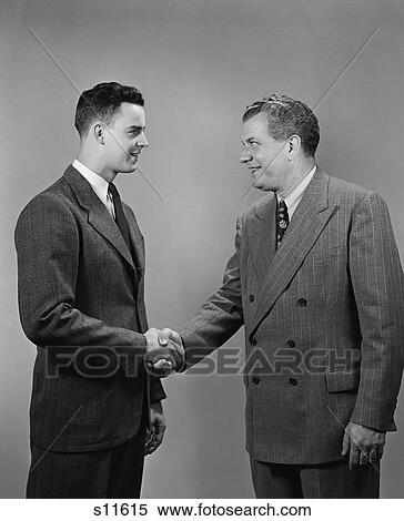1940S 1950S Two Business Men Of Different Generations Shaking Hands View Large Photo Image Stock Photography - 1940S 1950S Two Business Men Of Different Generations Shaking Hands. Fotosearch