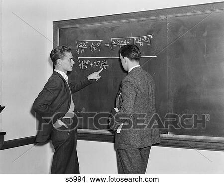 1940S 2 Students Professors Mathematicians Blackboard Studying Complex Equations View Large Photo Image Picture - 1940S 2 Students Professors Mathematicians Blackboard Studying Complex Equations . Fotosearch