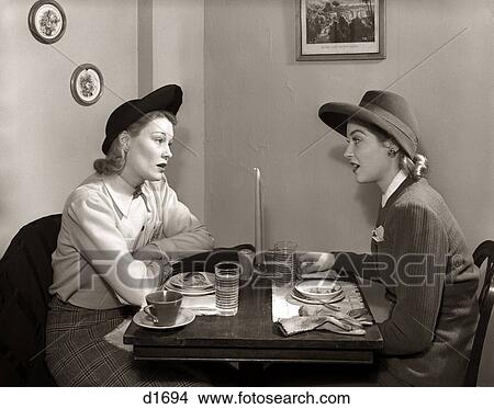 Picture - 1940S 2 Women Dining Talking Restaurant Table. Fotosearch