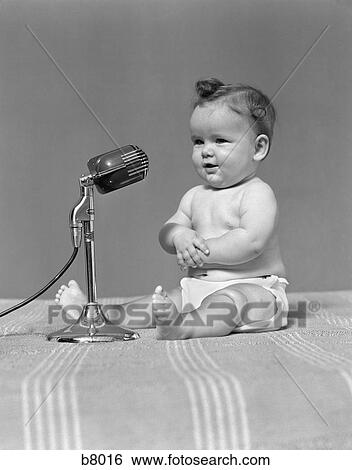Stock Photograph - 1940S Baby In Diaper With Microphone Studio. Fotosearch