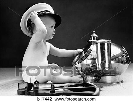 1940S Baby In Diaper With Ship Captain Hat Sextant And Nautical Compass View Large Photo Image Stock Image - 1940S Baby In Diaper With Ship Captain Hat Sextant And Nautical Compass. Fotosearch