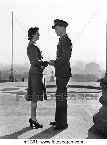 Stock Image - 1940S Couple Man Woman Holding Hands Steps Philadelphia Art Museum. Fotosearch