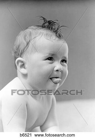 1940s Cute Baby Sticking Out Tongue Studio Stock Image B6521