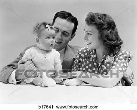 1940S Family Portrait Mother Father And Baby View Large Photo Image Stock Image - 1940S Family Portrait Mother Father And Baby. Fotosearch