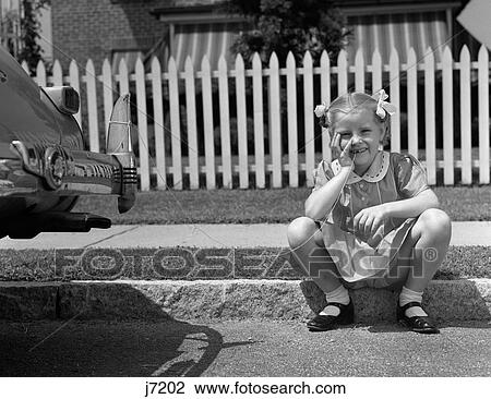1940S Girl Sitting On Curb With Tooth Tied To Back Of Car Fender View Large Photo Image Stock Image - 1940S Girl Sitting On Curb With Tooth Tied To Back Of Car Fender. Fotosearch